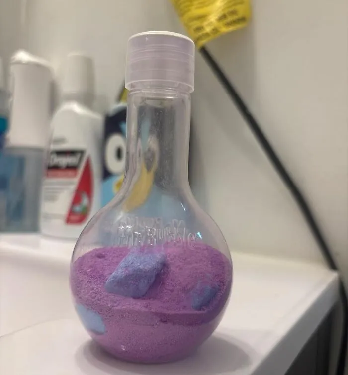 Purple bath powder in a unique bottle, perfect Easter basket stuffer to make candy look boring.