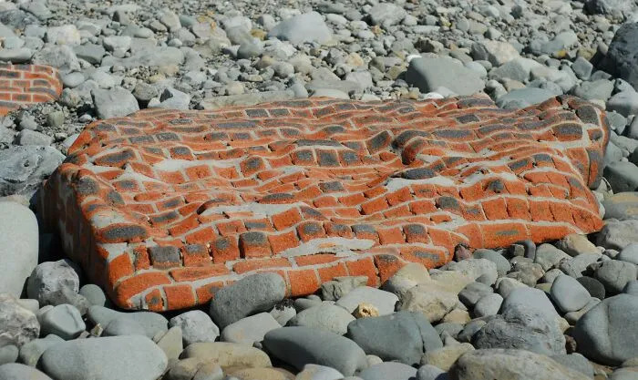 This Whole Brick Wall Which Has Been Shaped By The Sea