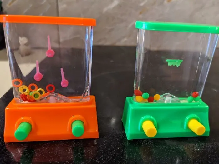 Smart Phone Getting You Down? Come Make 90s Vibes With This <a Style="Display:inline;" Href="Https://Www.amazon.com/Yoya-Toys-Handheld-Basketball-Compact/Dp/B071dtyzfz?ie=utf8&linkcode=ll1&tag=bprooster-20&linkid=954d93673383eadcb110bf1ee0b4c7ba&language=en_us&ref_=as_li_ss_tl" Target="_blank"><span Style="Font: Inherit; Color: #d74b1f"> Aqua Ring Handheld Game</Span> Which Offers A Simple Game Which Will Send You Flashbacks With A Dose Of Simple Fun