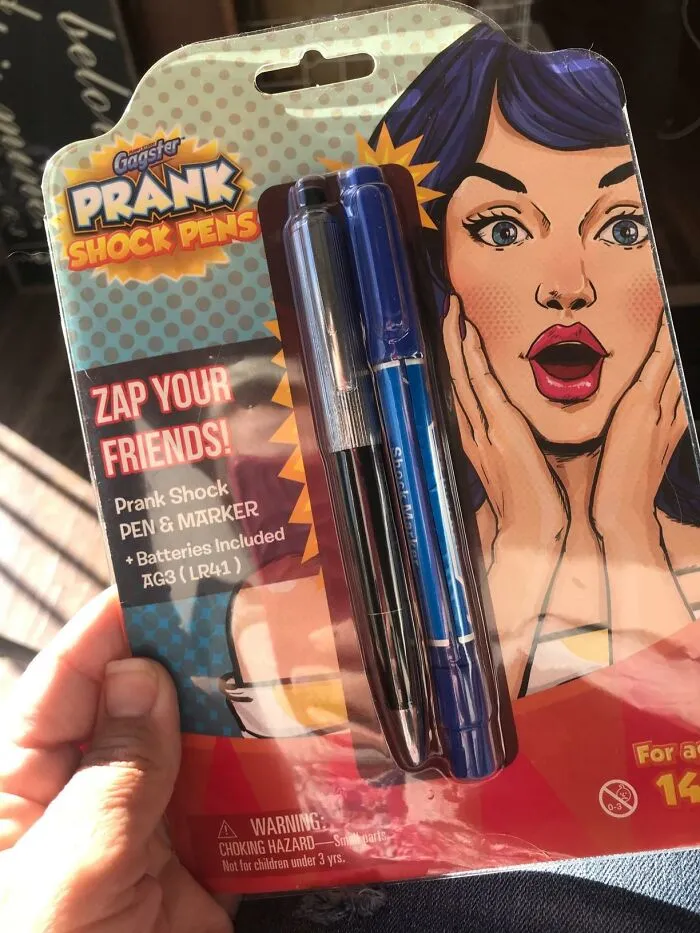 Prank shock pens package with cartoon woman surprised, ideal for April Fools pranks.