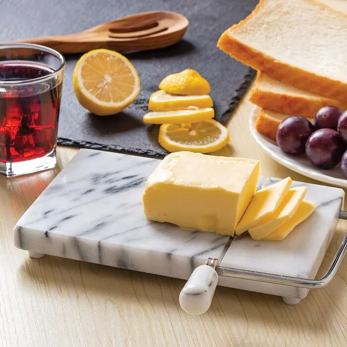 Roll With The Gouda Times With The <a Style="Display:inline;" Href="Https://Www.amazon.com/Dp/B0000vza2w?ascsubtag=7829966%2c19%2c34%2cd%2c0%2c0%2c0%2c1409%3a2%3b900%3a2%3b974%3a1%3b1125%3a2%3b1338%3a1%2c58729490%2c0%2c0&th=1%25252c0%252c0%2c0&btn_ref=srctok-F68e9586d172fed6&linkcode=ll1&tag=bppear-20&linkid=d31afc70141252532227ad040739c09d&language=en_us&ref_=as_li_ss_tl" Target="_blank"><span Style="Font: Inherit; Color: #d74b1f;"> Marble Cheese Slicer</Span> That's A Rock-Solid Way To Serve Up A Charcuterie Board