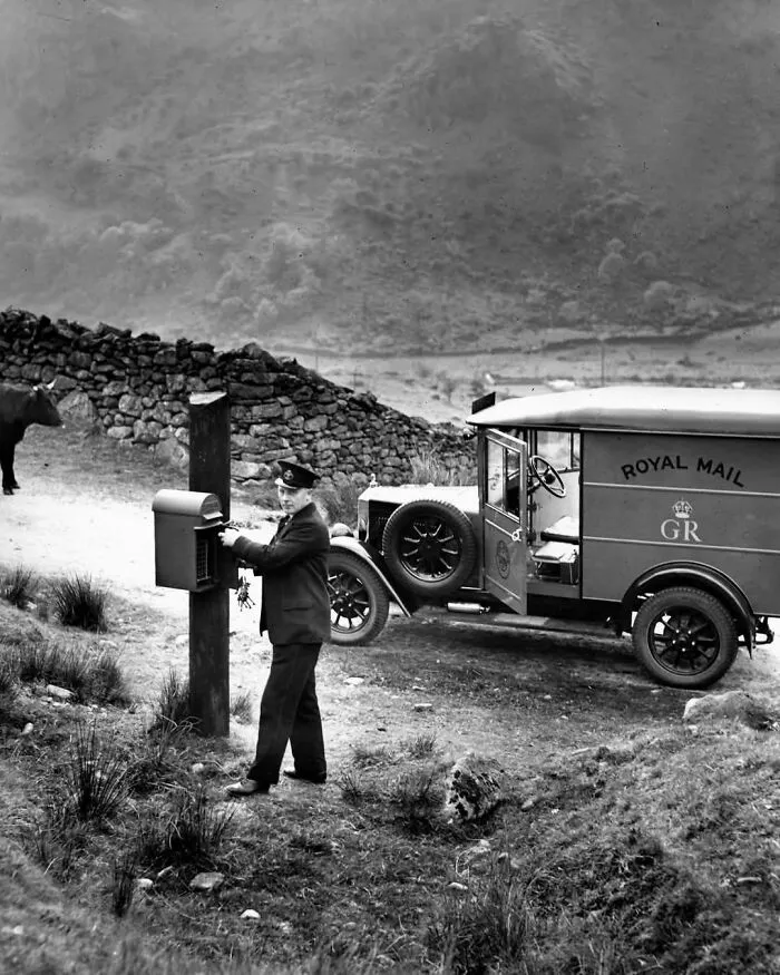A Postman Emptying A Very Small, Very Rural Box Near The Llanberis Pass In Eryri National Park