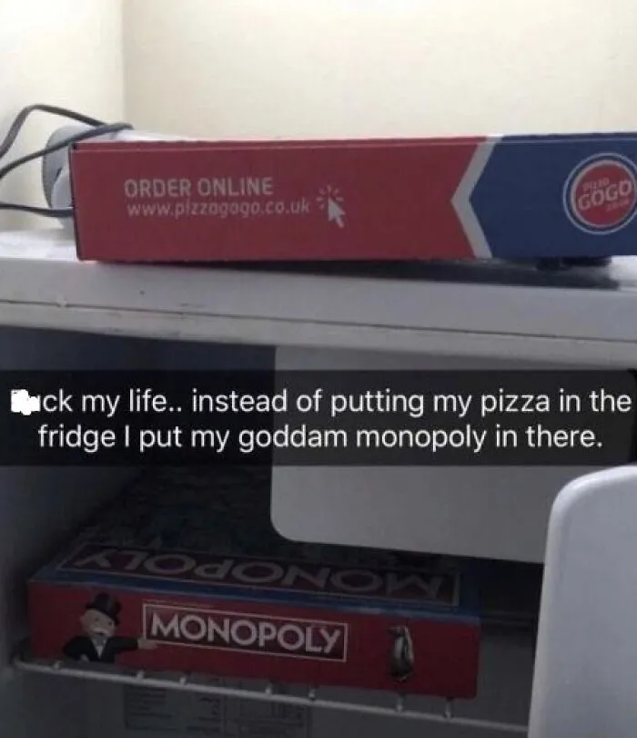 Pizza box on the counter, Monopoly board in the fridge with humorous text, capturing the essence of random memes.