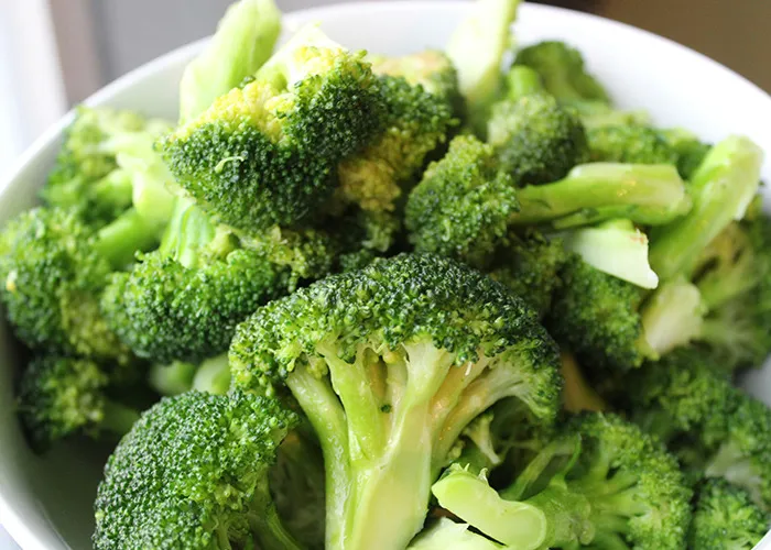 A bowl of fresh broccoli, commonly featured in extreme diets.