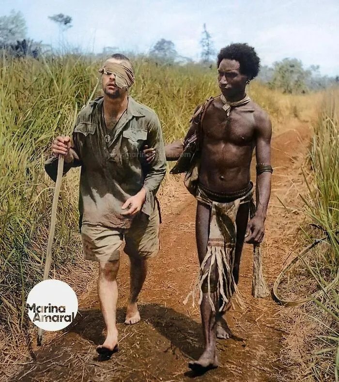 Australian Soldier, Private George "D**k" Whittington, Being Aided By Papuan Orderly Raphael Oimbari Near Buna On 25 December 1942