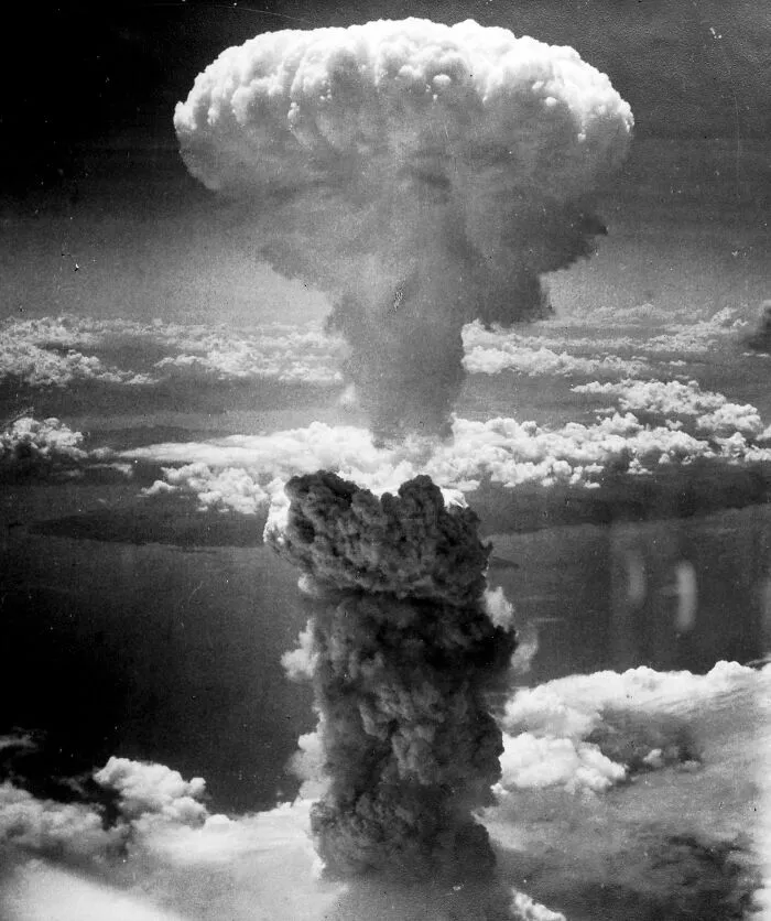 Mushroom cloud rising, symbolizing a major historical event, akin to future predictions coming true.