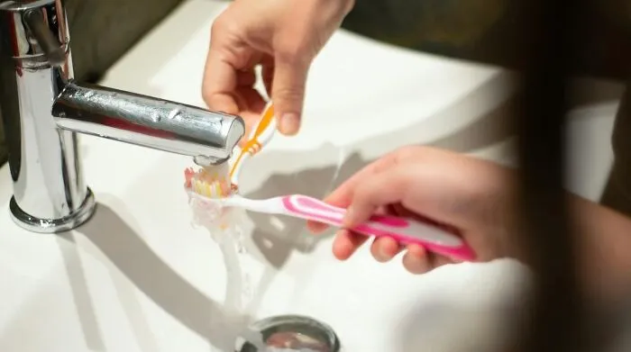 Watering The Toothbrush Before Putting The Toothpaste On Or After?