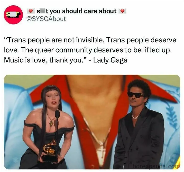 Two people on stage with a quote about love and visibility for the trans and queer community from Lady Gaga.