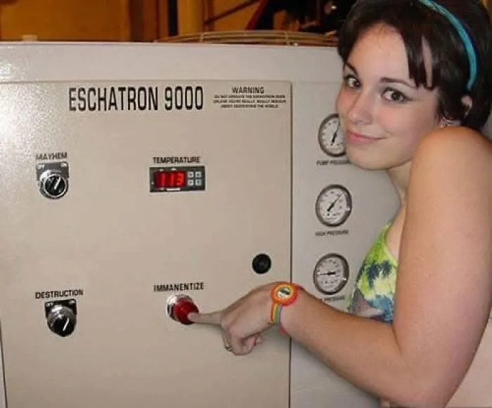 Person presses button on machine labeled "Eschatron 9000," humorously referencing mental health themes.