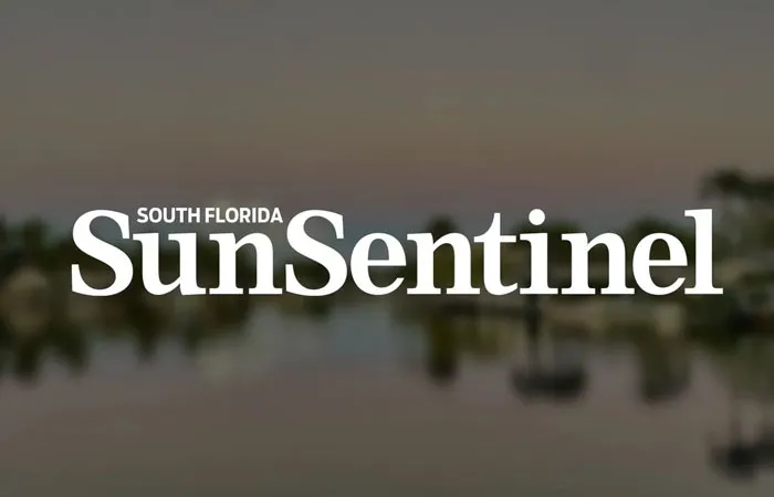 "South Florida Sun Sentinel logo on a blurred background."