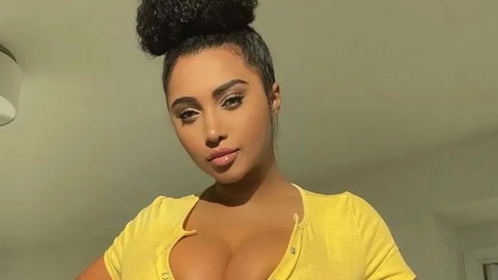 Person in a yellow shirt posing in a room, related to Florida Man headlines.