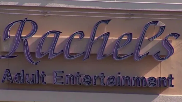 Sign for Rachel's Adult Entertainment, relating to a Florida Man headline.