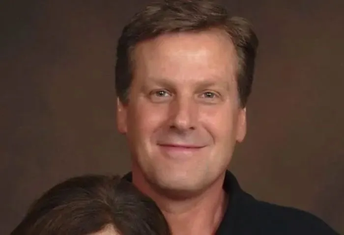 Middle-aged man smiling against a plain background, associated with Florida Man headlines.