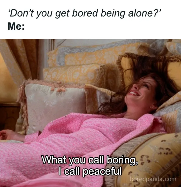 Woman in bed smiling, responding to a question about being bored alone, exemplifying women's humor through a meme.