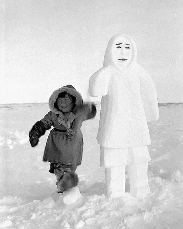 Richard Harrington: Theresie, Three-Year-Old Daughter Of Erkuaktok (Iquugaqtuq), A Pelly Bay (Arvilikjuaq) Inuk, Standing Next To A Snowman Carved By Her Father, 1951