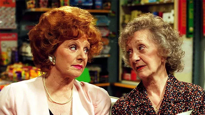 Two women in a store setting, exchanging skeptical glances, highlighting women's experiences with dating challenges.