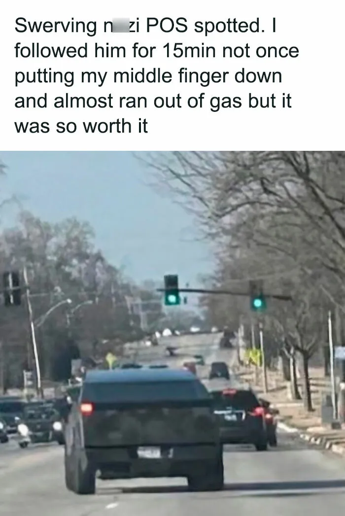 Traffic scene featuring a black SUV under a green traffic light, representing unwanted hot take commentary.