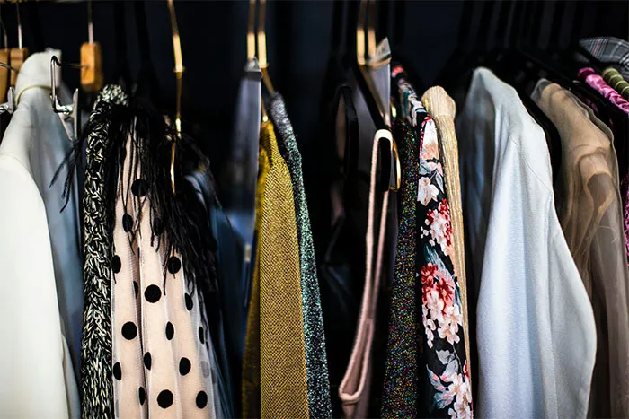 Various dresses on hangers, representing bridesmaids' requests.