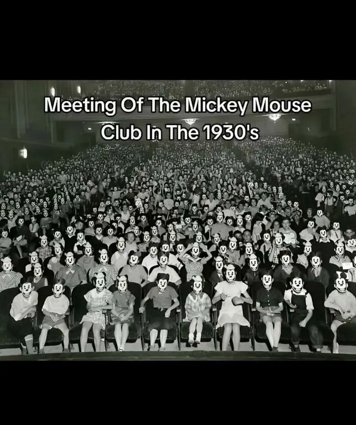 Large black and white 1930s crowd photo with edited spooky Mickey Mouse faces, illustrating spooky facts about our world.