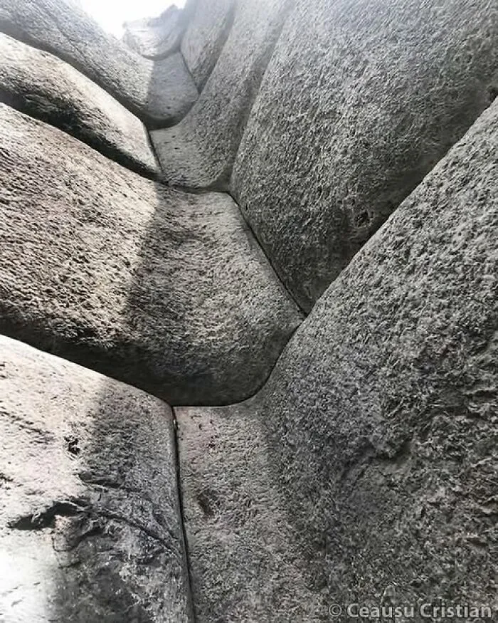 Close-up view of ancient stone blocks with tight joints showcasing archaeology news and architecture details.