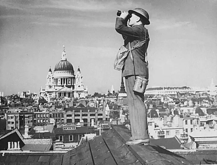 Aircraft Spotter On The Roof Of A Building In London. St. Paul's Cathedral Is In The Background