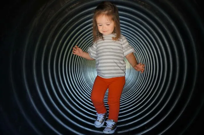 Took A Picture Of My Daughter Walking Through A Tunnel And The Lighting Made It Look Like A Bad Photoshop