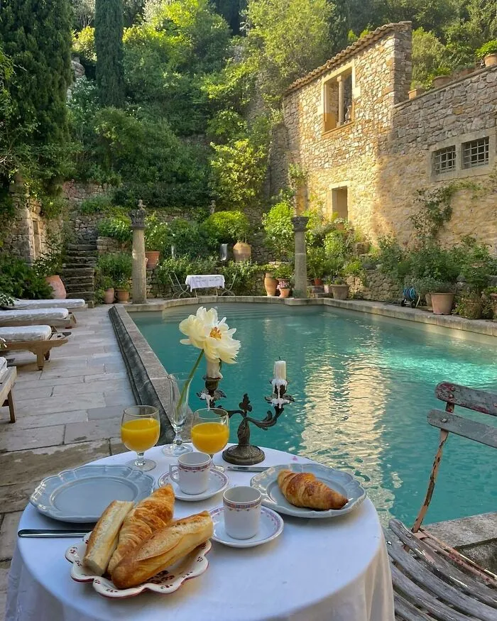 Breakfast By The Pool With Views Of The Garden At A French Country Villa, Provence, Southeastern France