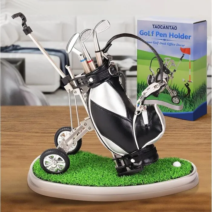 Golf bag pen holder on desk, unique work supplies decor.