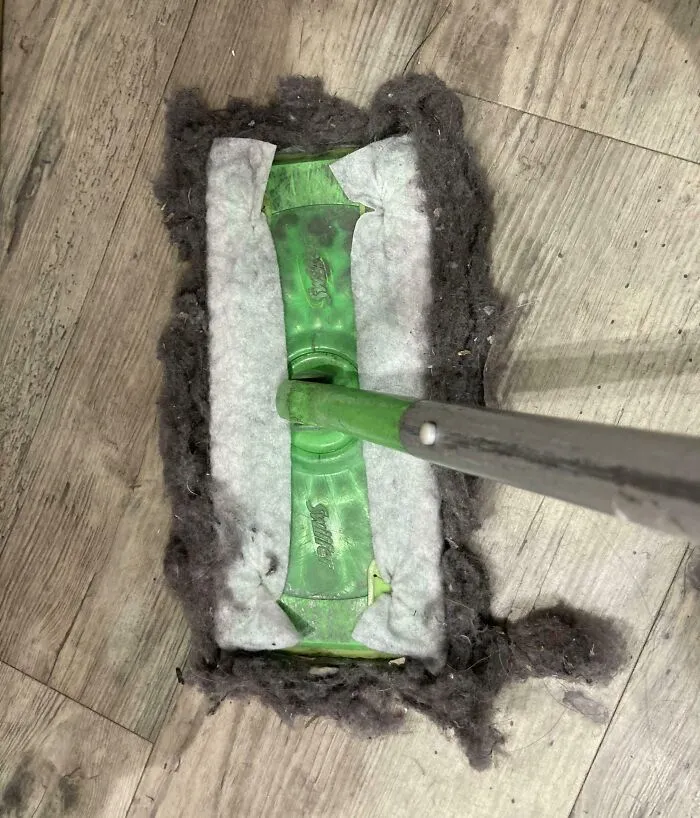 Green mop head covered in dust, illustrating challenges with infuriating bosses and workplace cleanliness issues.
