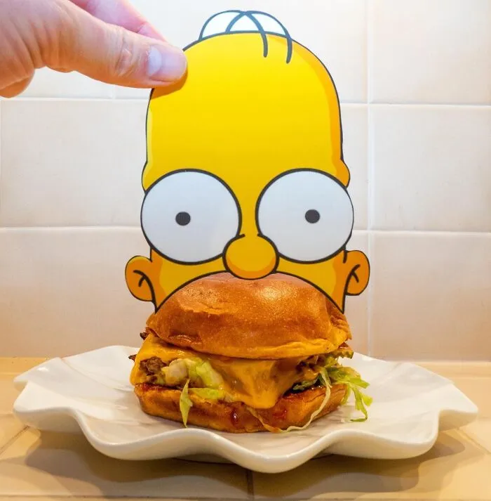 Street Artist Uses Paper Cutouts Of The Simpsons To Interact With The World Around Them (15 Pics)