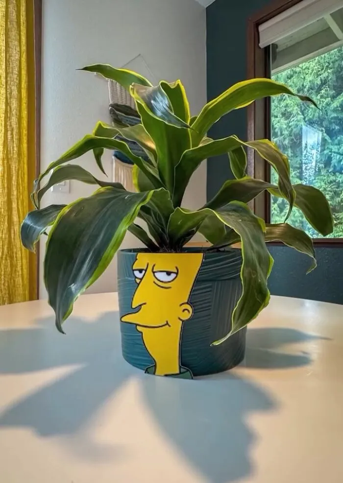 Street Artist Uses Paper Cutouts Of The Simpsons To Interact With The World Around Them (15 Pics)