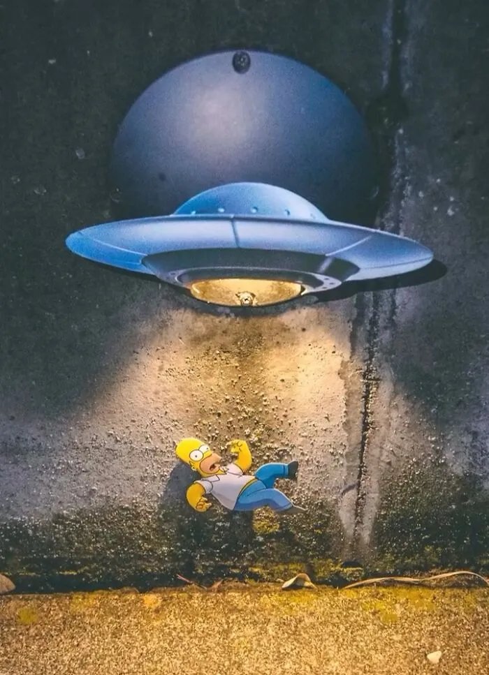 Street Artist Uses Paper Cutouts Of The Simpsons To Interact With The World Around Them (15 Pics)
