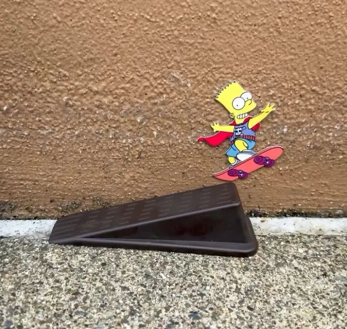 Street Artist Uses Paper Cutouts Of The Simpsons To Interact With The World Around Them (15 Pics)