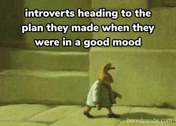 A cartoon introvert rabbit in a coat walks wearily, capturing the socially exhausted struggle. Text: "introverts heading..."