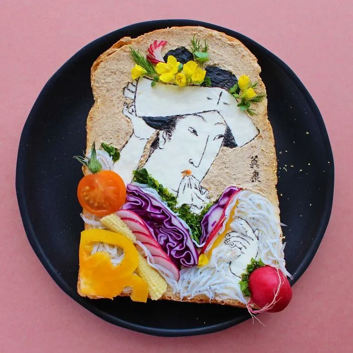 Creative toast design by Japanese artist features intricate food art resembling traditional Japanese painting.