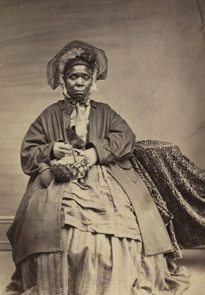 Full-Length Portrait Of An African American Woman Holding A Basket, C. 1864