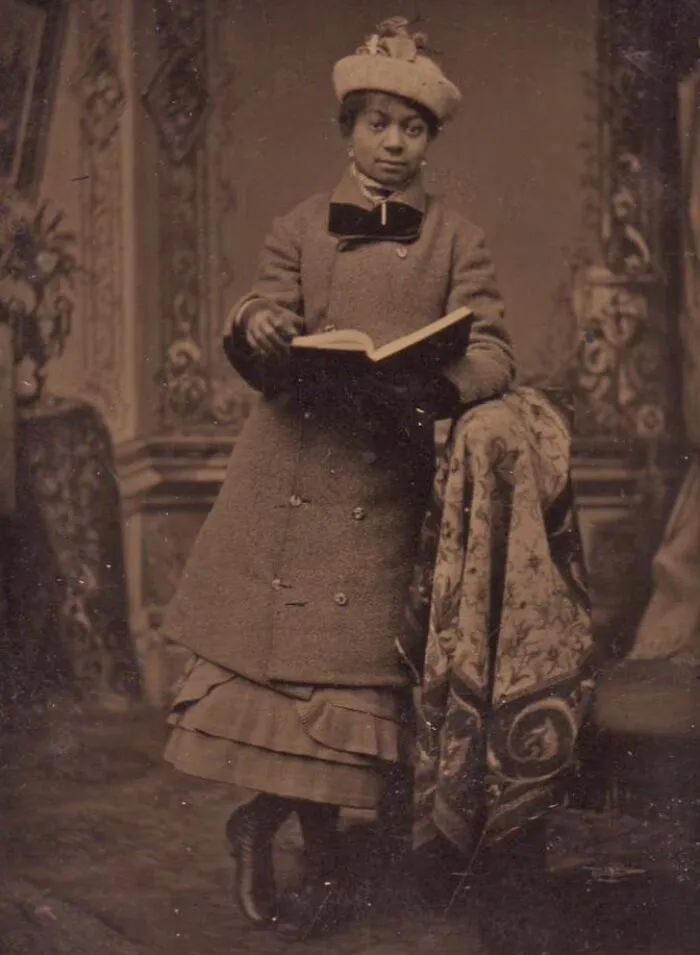 Well Dressed Young African-American Woman Holding A Book