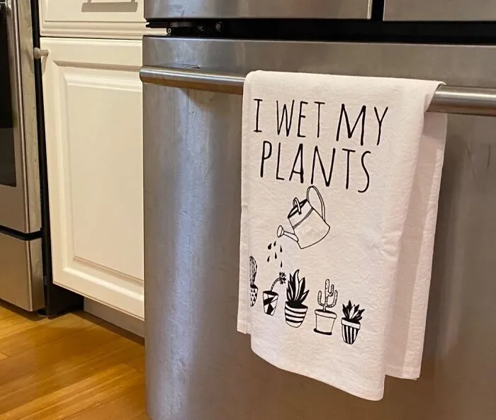 An "I Wet My Plants" <a Style="Display:inline;" Href="Https://Www.amazon.com/Funny-Dishcloth-Plants-Kitchen-Cloth/Dp/B077ndw8k5?ie=utf8&th=1&linkcode=ll1&tag=bpcow-20&linkid=8dcd09b64b3f7c42eb70631389162059&language=en_us&ref_=as_li_ss_tl" Target="_blank"><span Style="Font:inherit;color:#d74b1f;"> Kitchen Dishtowel</Span> Embraces Mom's Love For Gardening With A Punny Twist That's Guaranteed To Get A Chuckle
