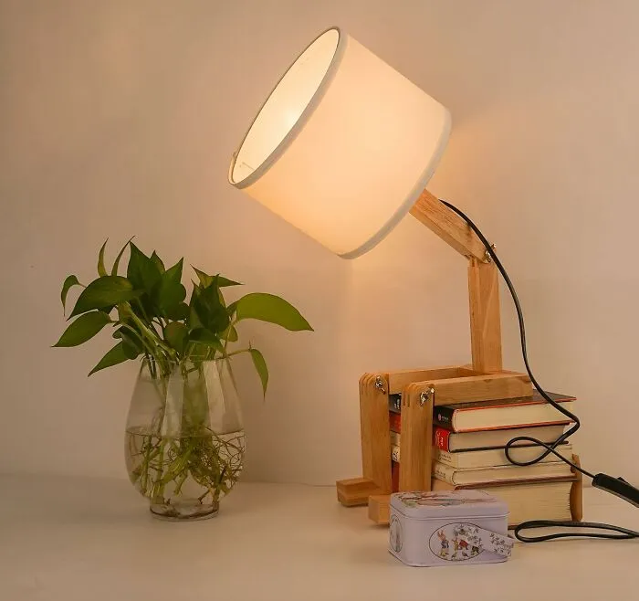 Stop Relying On The Harsh Glare Of Your Ceiling Light (Or Worse, Your Phone Flashlight) And Add Some Actual Ambiance With This Personality-Packed <a Style="Display:inline;" Href="Https://Www.amazon.com/Elinkume-Bedside-Lampshade-Foldable-Creative/Dp/B07pbhflkk?crid=2ljdcdfzjsbdw&dib=eyj2ijoimsj9.4p2noy40tjztrblzu46bvsp2eiootehp9wwf5frkc5a4glvubkq4d7tj9hzponysh2sxhnzncf0h0emdfrklivq4rvoponj7fp2bgskrbadozf6hcbmblhlmcsozvogbeehnj5qbp9obhsovppt3drveshote9agfcaay0jvm0wubcqj90nkqb8ocdnu6ulsgt6d4a2up8d6yalthxs1olxo6a1gubd06hwqsaikot1lpwl5dula8u5y8svqskwzmmncxml8sfa4blfdgbfvivlmegk8wefcdq3m3z7axvk.nrl_1vy9ieibwwa33oi3ht3hco4qcvbyrzuhxm-N6s8&dib_tag=se&keywords=cool%2blamp&qid=1744359694&sprefix=cool%2blamp%2caps%2c235&sr=8-7&th=1&linkcode=ll1&tag=bpbeaver-20&linkid=1ef6aa2a861f8e16a69d99670c0127a2&language=en_us&ref_=as_li_ss_tl" Target="_blank"><span Style="Font: Inherit; Color: #d74b1f;"> Bedside Lamp </Span> That Looks Like It's Ready To Read Your Books For You