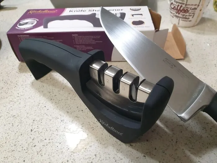 That Sad Tomato You Just Attempted To Slice For Your "I Guess This Is Lunch" Wednesday Meal Probably Looks More Like A Tragic Abstract Painting, But This <a Style="Display:inline;" Href="Https://Www.amazon.com/Kitchen-Knife-Sharpener-Sharpening-Cut-Resistant/Dp/B079wwfzy6?ie=utf8&linkcode=ll1&tag=bporange-20&linkid=9dddaf8674d1e6f001cc40383e5ec6e4&language=en_us&ref_=as_li_ss_tl" Target="_blank"><span Style="Font: Inherit; Color: #d74b1f;"> 3-Stage Knife Sharpener </Span> Is Ready To Bring Your Blades Back From The Brink Of Culinary Despair