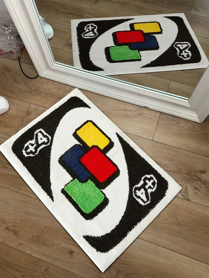Colorful rug resembling a card game, laid on wooden floor near a mirror, enhancing work supplies with a fun touch.
