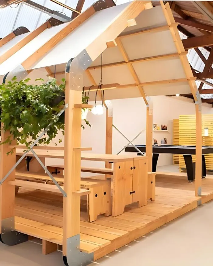 Modern wooden structure with built-in bench and table showcasing creative woodworking ideas and designs.