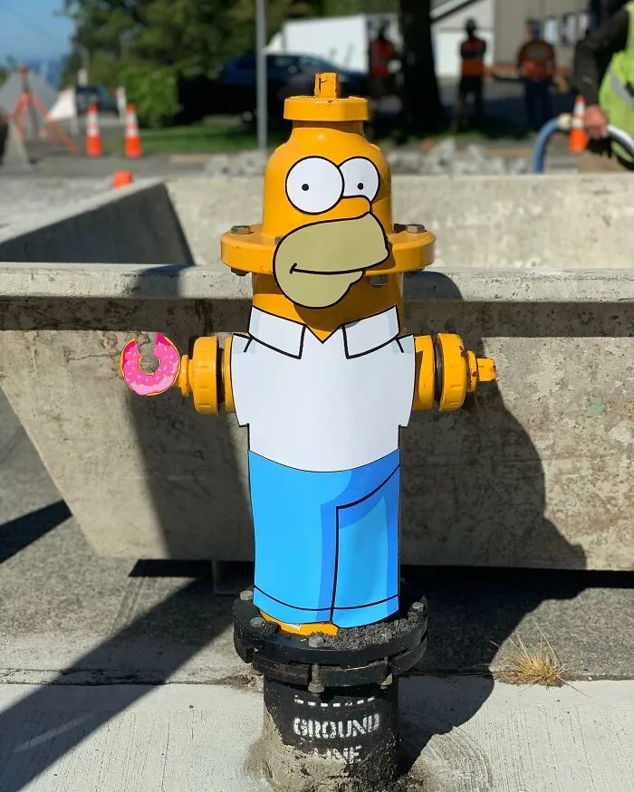 Street Artist Uses Paper Cutouts Of The Simpsons To Interact With The World Around Them (15 Pics)