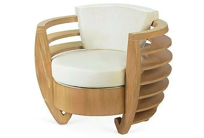Modern wooden armchair with curved slatted frame and white cushioned seat, showcasing creative woodworking ideas.