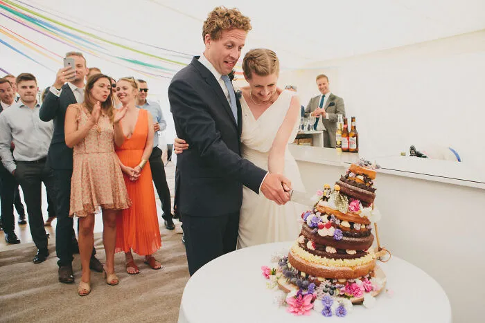 Champagne Taittinger Wedding Food Photographer: Carina & Sven Cut A Wobbly Cake Made By Their Friend! By Emma Stoner, United Kingdom