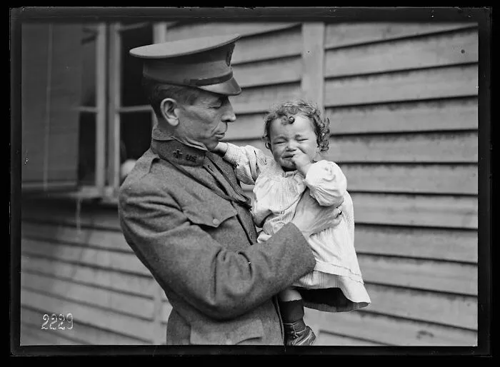 American Red Cross Worker Who Wants To Make Friends With A Little Refugee Just Arrived At The American Red Cross Canteen At The Gare De L'est, Where All Refugees Coming To The Station Are Fed Free Of Charge, Cared For And Helped On Their Way, 7 June 1918