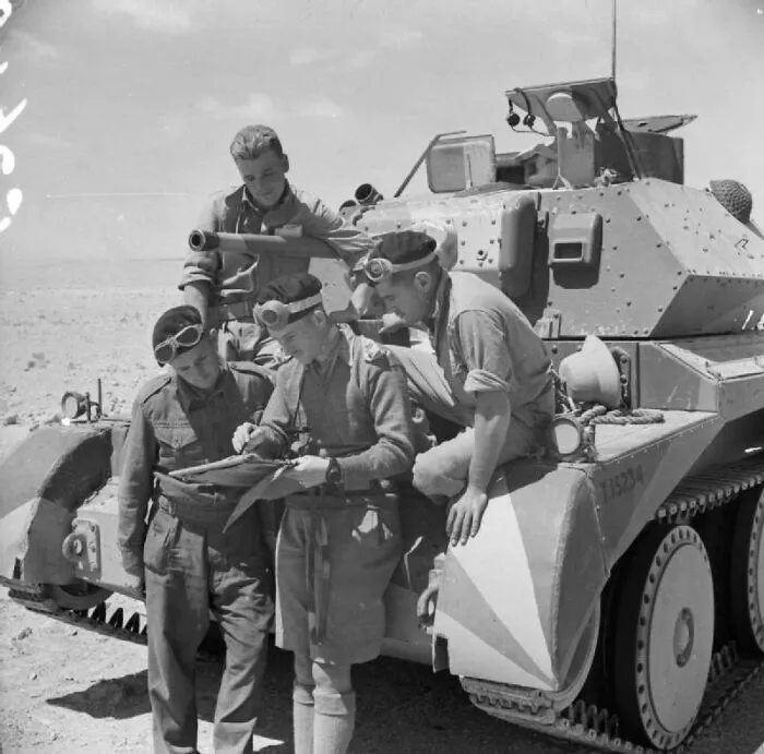 The Crew Of A British Cruiser Mk Iv Tank Studying A Map In The Western Desert, Egypt, 30 April, 1941