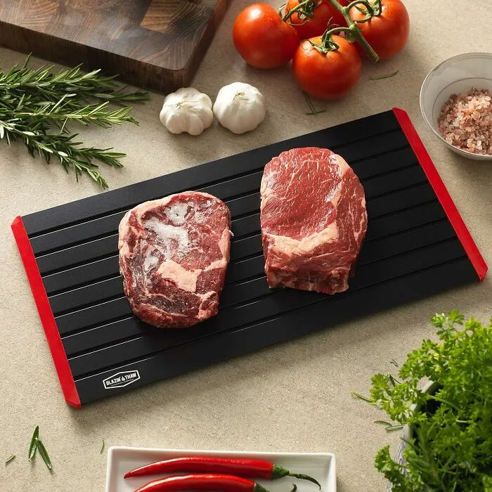 Your Wednesday Evening's Classic "Oh Shoot, The Chicken Is Still An Ice Sculpture" Dilemma Is About To Become Way Less Tragic Thanks To This <a Style="Display:inline;" Href="Https://Www.amazon.com/Family-Size-Defrosting-Aluminium-Silicone-Microwaves/Dp/B07m98n6lf?crid=1cuaa8dk8myt6&dib=eyj2ijoimsj9.72detfowb4q93jmsbp5sx7zvpseofdceribl-Nyjmqeym6lefcibvx-Fjaxqstqaznc1ebt_mht-Zpllvstm_t3kbfl4t3k30xkwatgxmsxmficmub7y4ldkoejsmnioxuj1px0nypcjil7cr_bmsyobp2tuskllp_2nqx3lexvt23s6f-1wec5c_4llb6mhrbbsaebu5fzrbiojubcos0acn-8zrvespkfwb2avsarm5qn3z9_tdwa_ryebm8hbwqkvayhbql-Toh4nbeloenpomfacbyqirs4whg7maio.edk72nj61l5_6ypbtpqirhyumfeovnzi0cembw9ztps&dib_tag=se&keywords=defrosting%2btray&qid=1745912474&sprefix=defrosting%2btray%2b%2caps%2c202&sr=8-1-Spons&sp_csd=d2lkz2v0tmftzt1zcf9hdgy&th=1&linkcode=ll1&tag=bporange-20&linkid=fdd43a1897618b4c7deec3694c94ec33&language=en_us&ref_=as_li_ss_tl" Target="_blank"><span Style="Font: Inherit; Color: #d74b1f;"> Defrosting Tray For Meat </Span>, Which Thaws Things Out Faster Than Your Motivation To Cook Dinner Usually Disappears