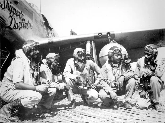 Fliers Of A P-51 Mustang Group Of The 15th Air Force In Italy In The Shadow Of One Of The Mustangs They Fly, August, 1944