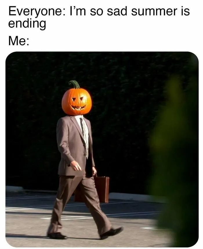 Person in suit with pumpkin head walking humorously, referencing "The Office" memes.